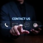 Contact us or the Customer support hotline people connect. Businessman using mobile phone and using hand touching virtual icons call phone, email, address, and live chat. Customer service call center.